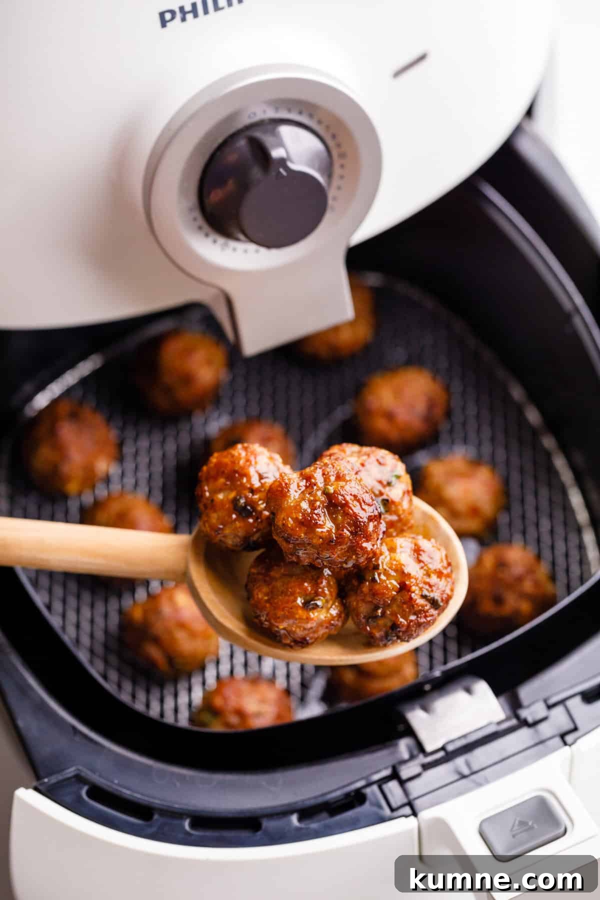 Cooking on Busy Weeknights Meatballs being cooked in an air fryer.