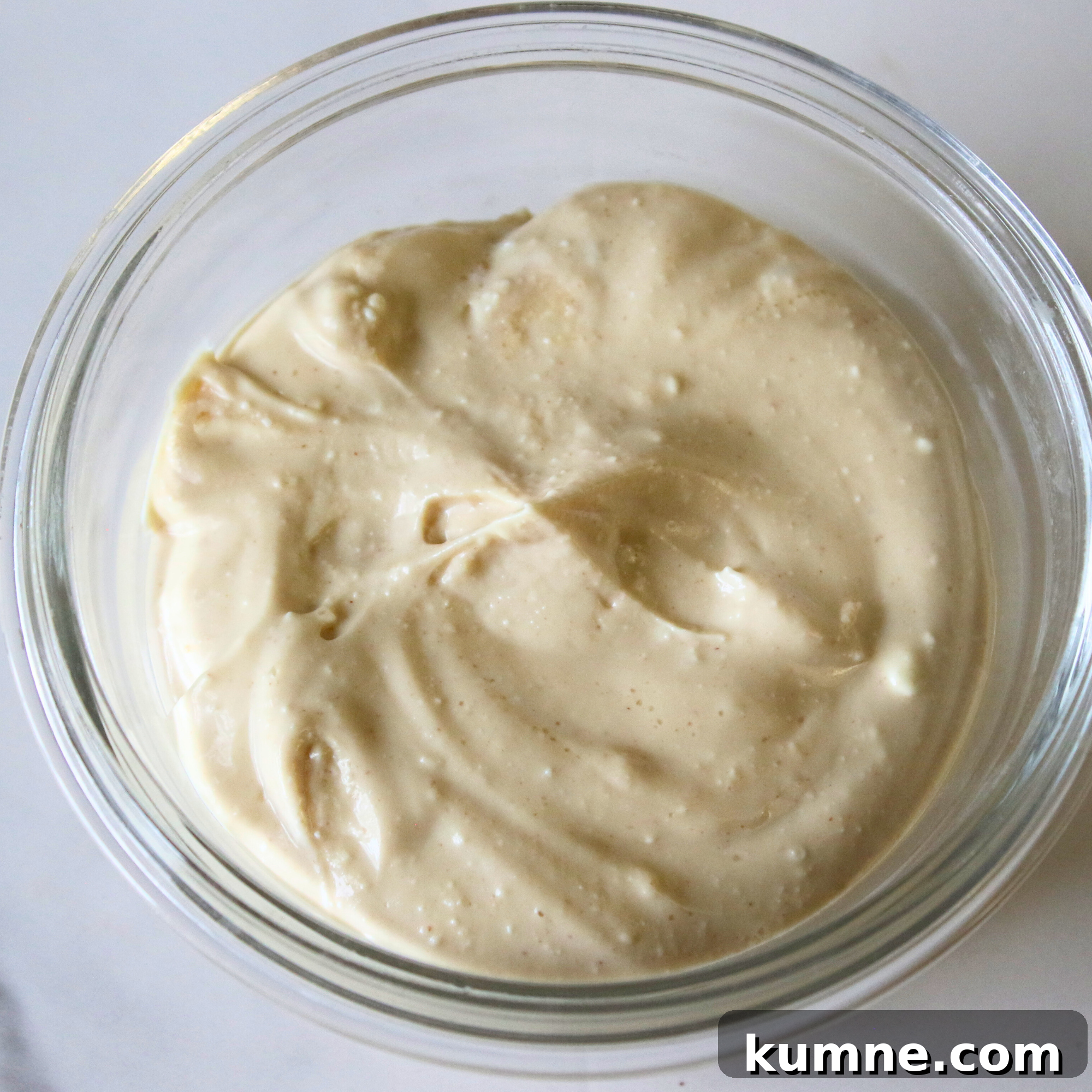 Light and Creamy Protein Fluff Dessert Recipe 2 A creamy pudding in a glass bowl.