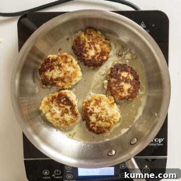 Golden brown cauliflower cakes fried in olive oil.