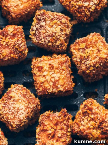 Close up of crispy breaded air fryer tofu with panko breadcrumb crust