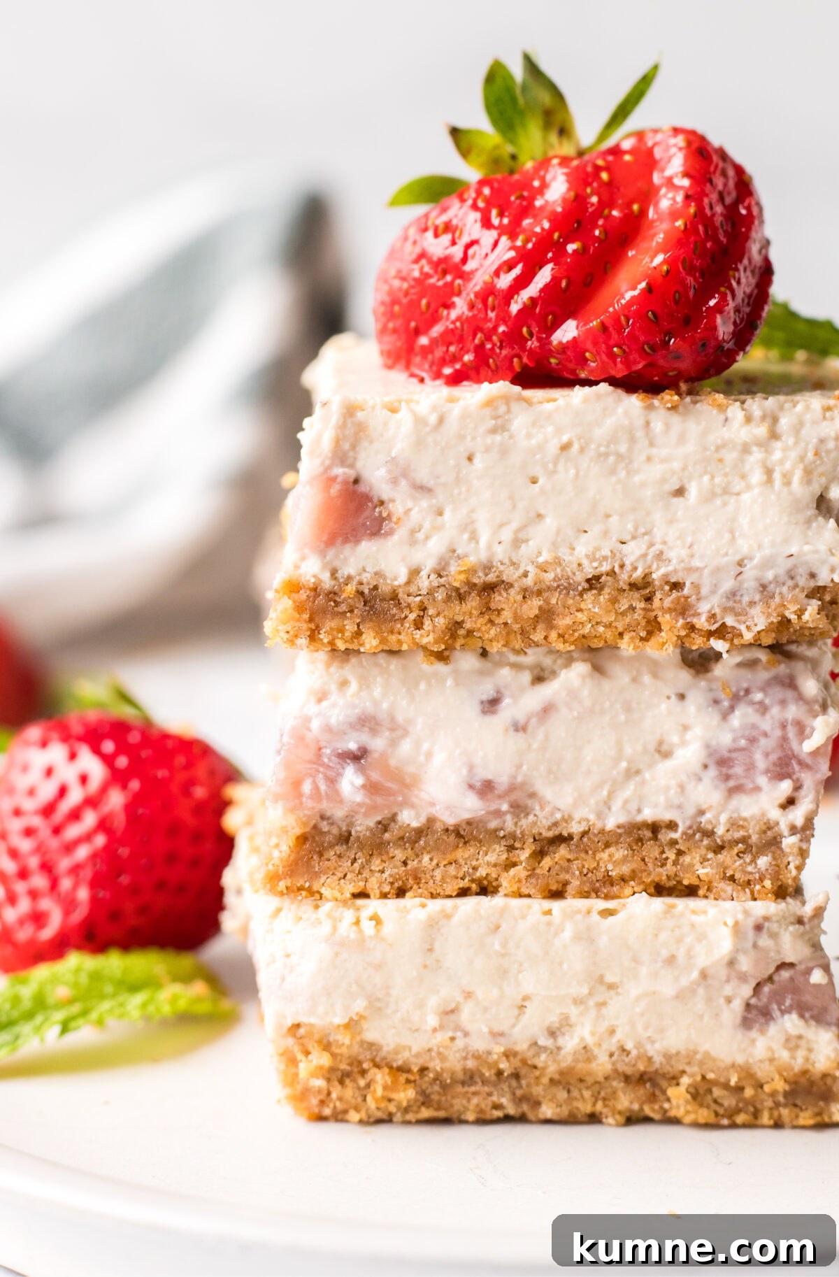 stack of three strawberry cheesecake bars