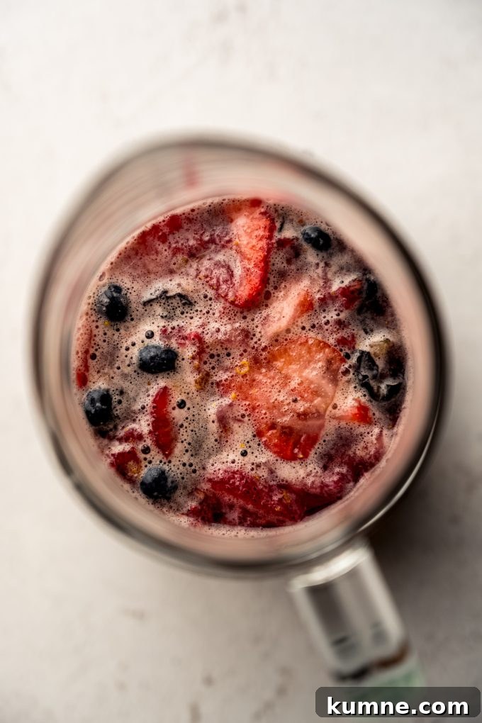 Berry Sangria and Refreshing Non-Alcoholic Berry Mocktail 13 Aerial photo of berry sangria in a glass pitcher.