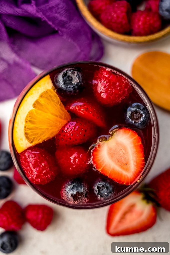 Berry Sangria and Refreshing Non-Alcoholic Berry Mocktail 16 Aerial photo of a glass of berry sangria.