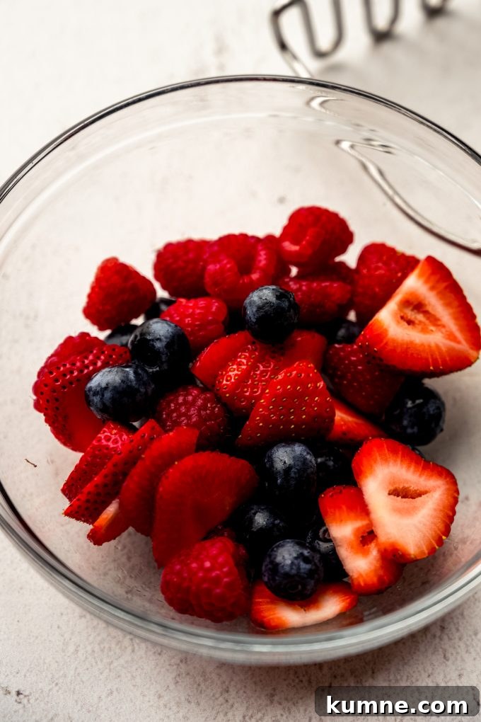 Berry Sangria and Refreshing Non-Alcoholic Berry Mocktail 6 A bowl of blueberries, strawberries, and raspberries.