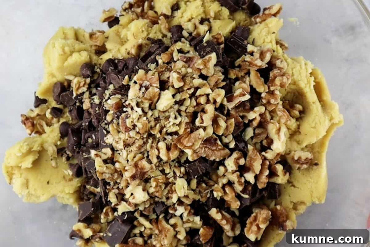 adding chocolate and nuts to batter