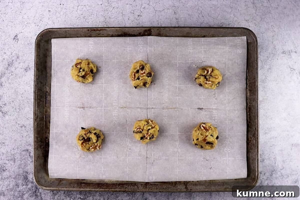 spoonfuls of cookie dough on baking sheet