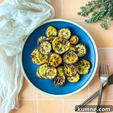 Air fryer zucchini and squash on a blue plate.