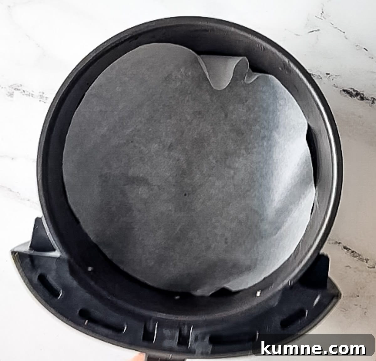 parchment paper in air fryer basket.