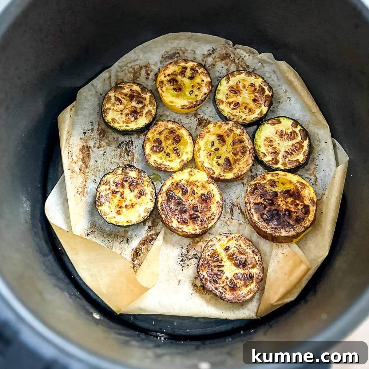 Fully cooked air fryer zucchini and squash in the air fryer basket.