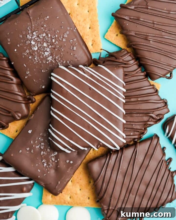 Chocolate covered graham crackers are ready to eat on the table.