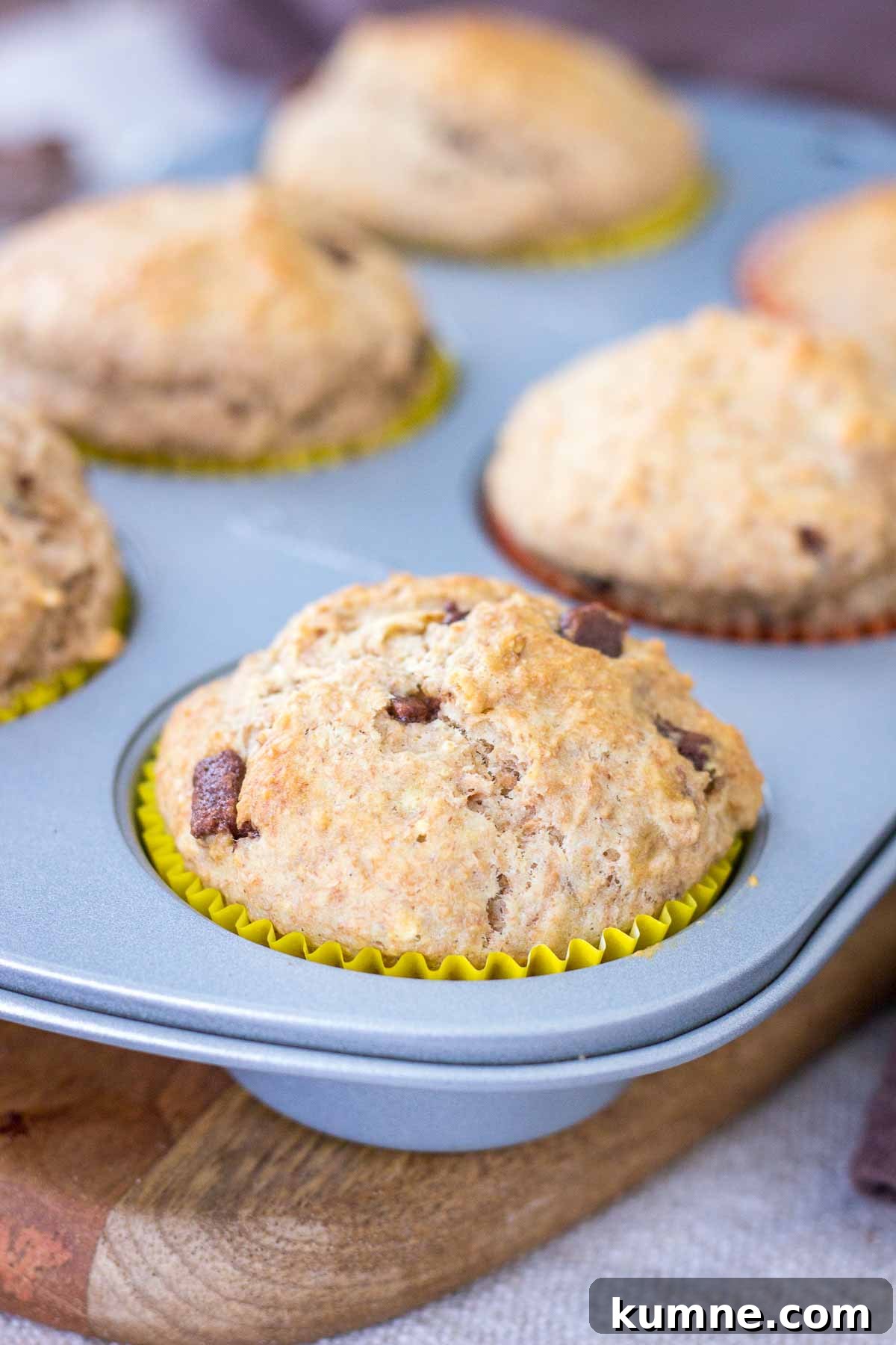 Chocolate Chip Banana Muffins in a muffin tin.