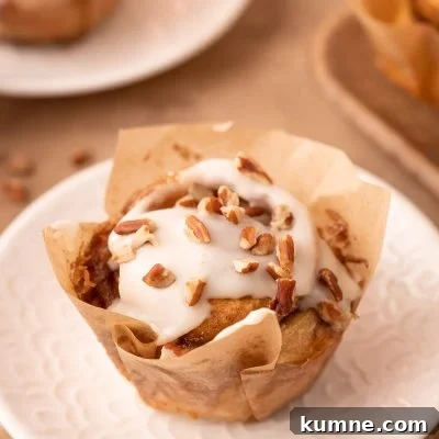 Easy Pecan Roll in a pastry lined on a white plate.