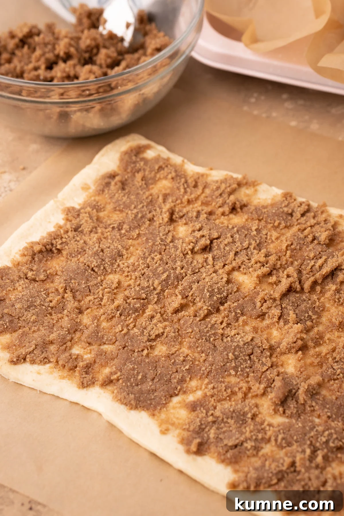 Crescent roll dough covered in brown sugar cinnamon mixture.