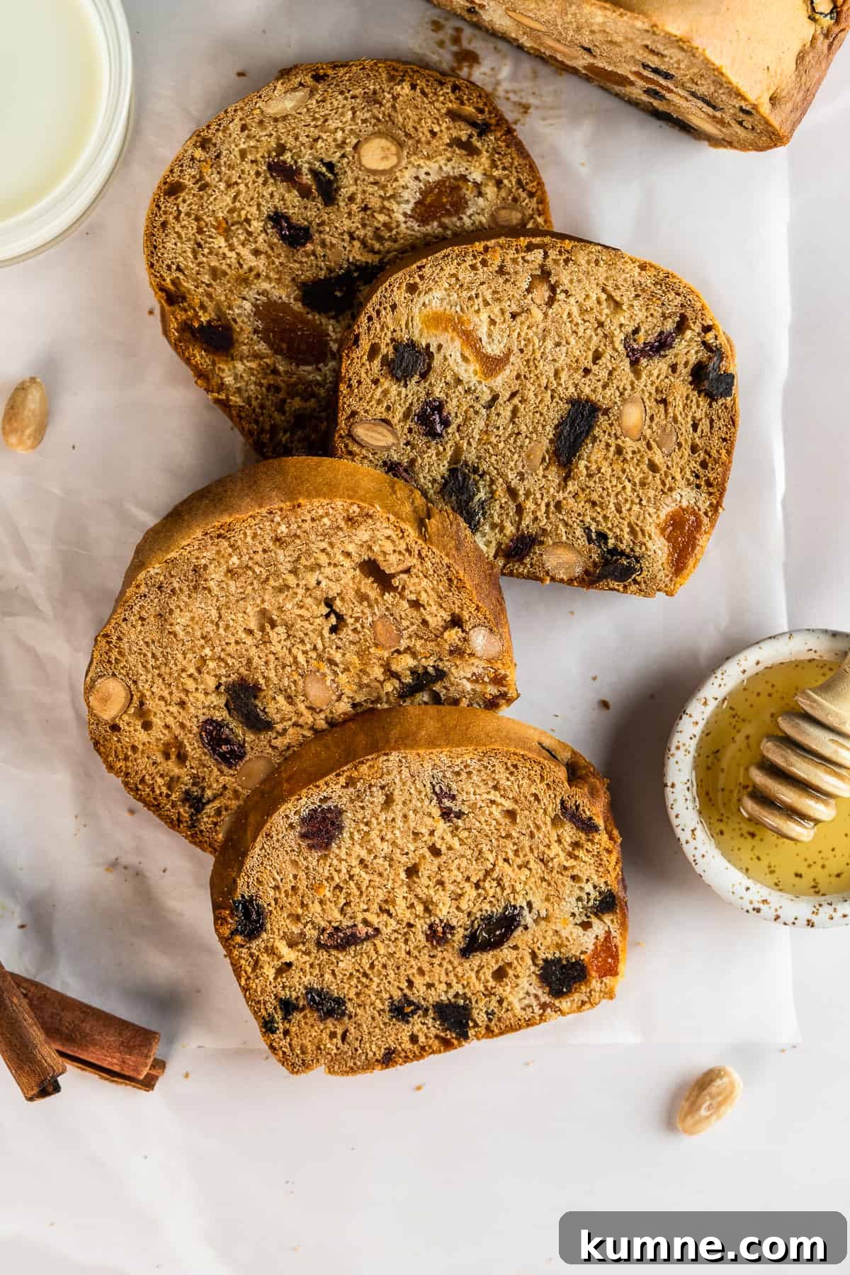 Sliced French gingerbread loaf on parchment paper .