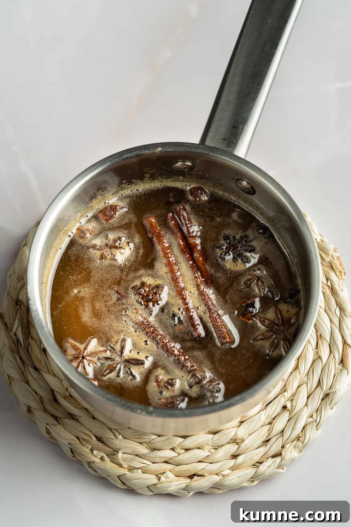 Spiced honey syrup in a saucepan . 