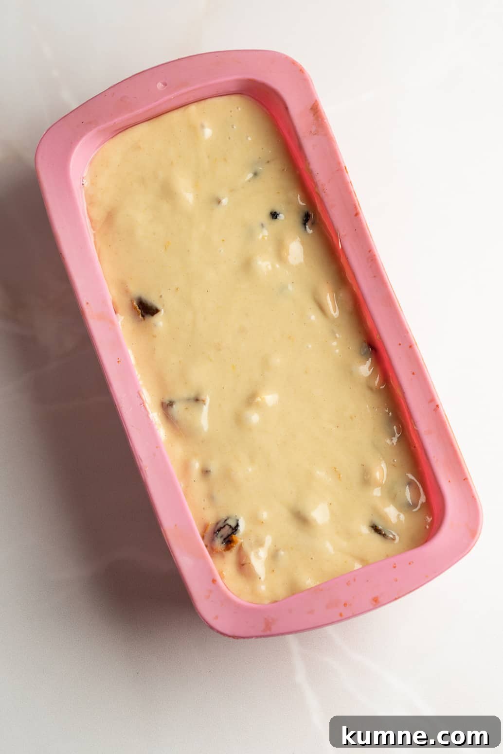 Bread batter in a silicone mold .
