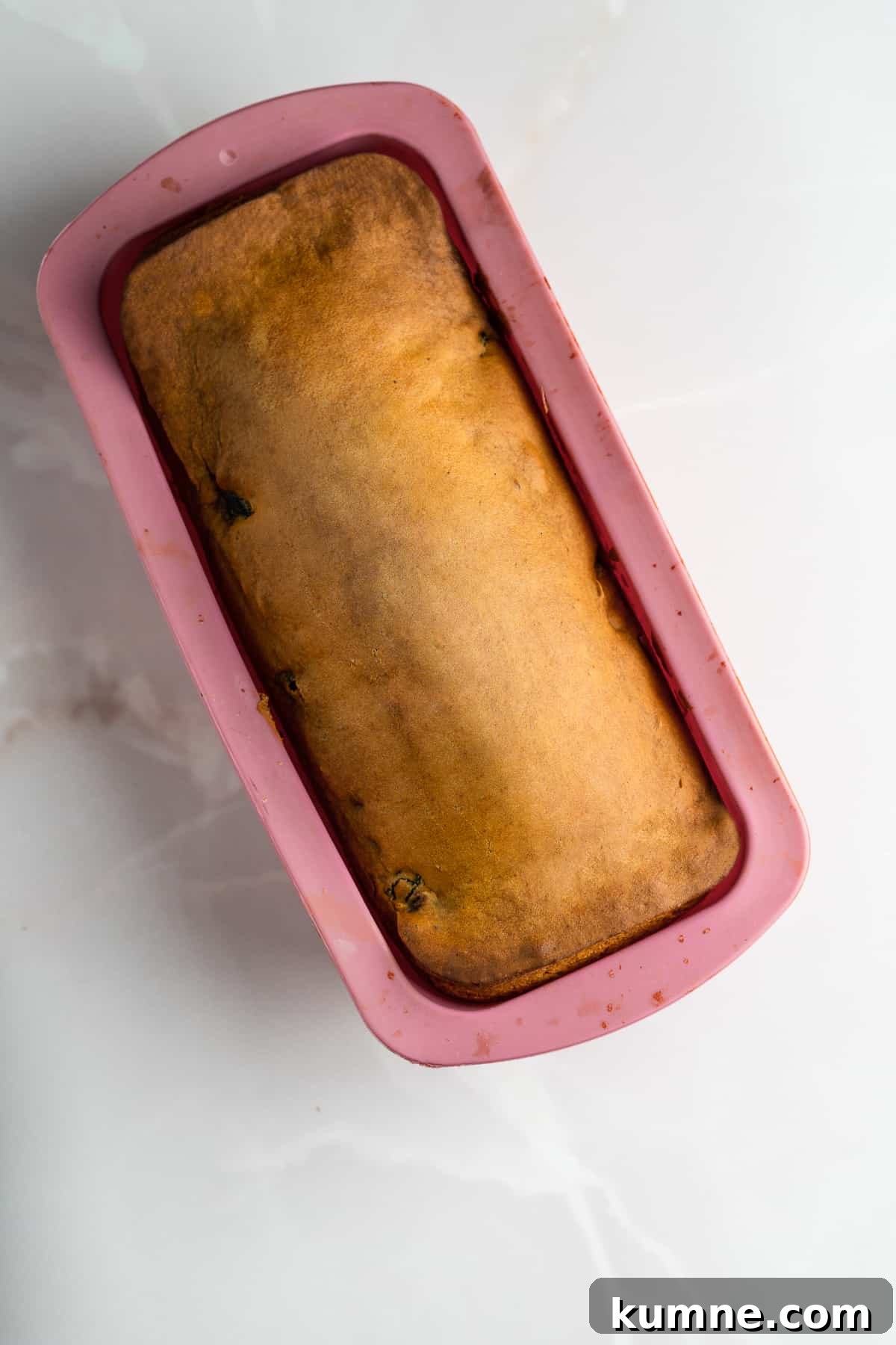 Baked loaf in a pan .