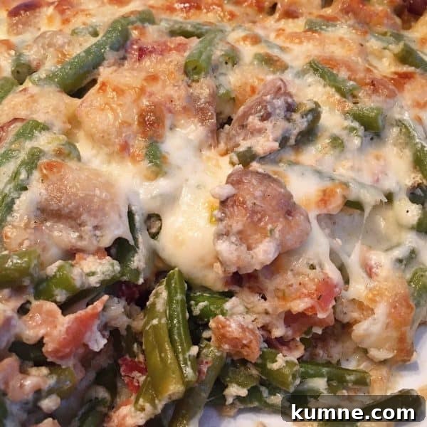Crispy Fresh Green Bean Casserole with Garlic and Parmesan 14 Green bean casserole with a serving missing.