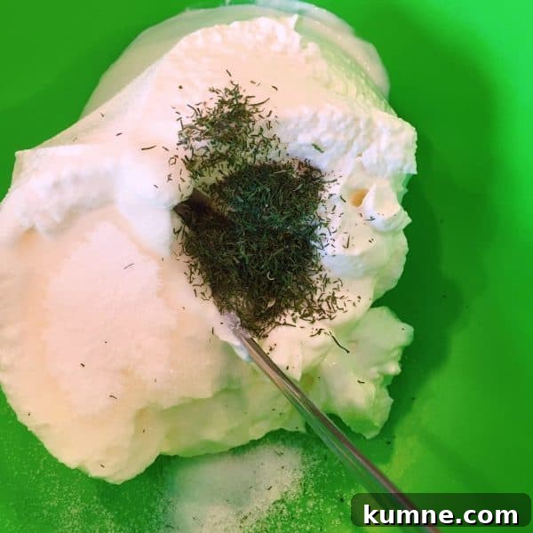Crispy Fresh Green Bean Casserole with Garlic and Parmesan 3 sour cream, dill weed, sugar, and salt in a bowl