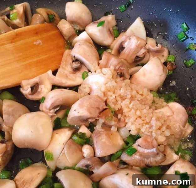 Crispy Fresh Green Bean Casserole with Garlic and Parmesan 7 adding garlic to mushroom in skillet