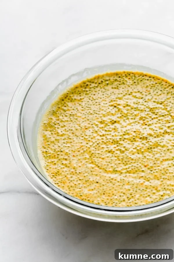 Turmeric Golden Milk Chia Pudding Recipe 8 a clear mixing bowl with golden milk latte chia pudding in it