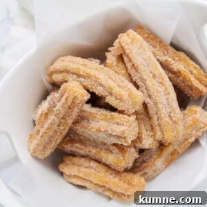Fresh churros coated in cinnamon sugar.