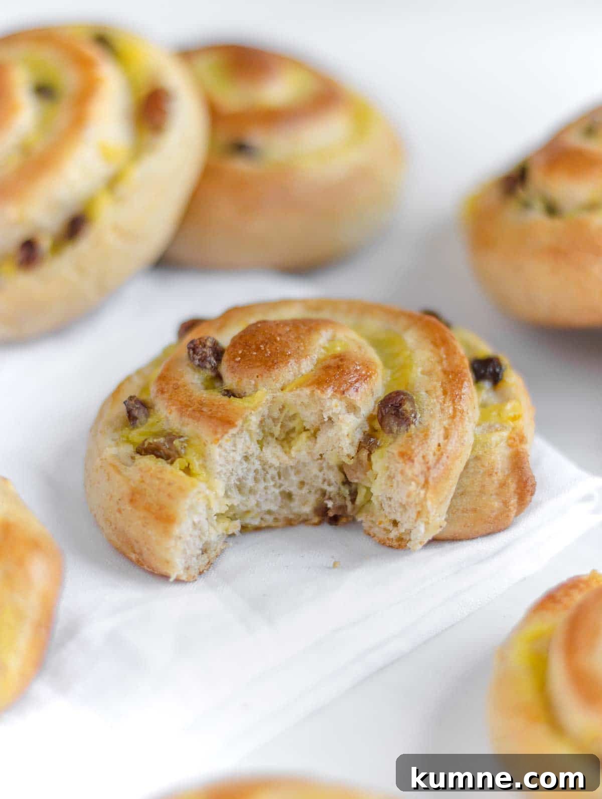 Vegan Brioche Rolls with Smooth Vanilla Custard Filling 4 bitten vegan brioche roll with custard
