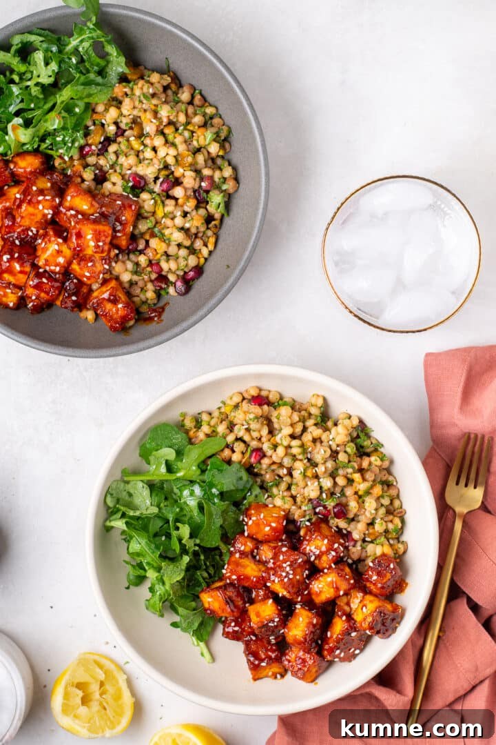 Apricot Harissa Tofu with Couscous Pilaf — Sweet and Spicy Flavor 18 two bowls of apricot harissa tofu with couscous pilaf and arugula for a plant-based dinner