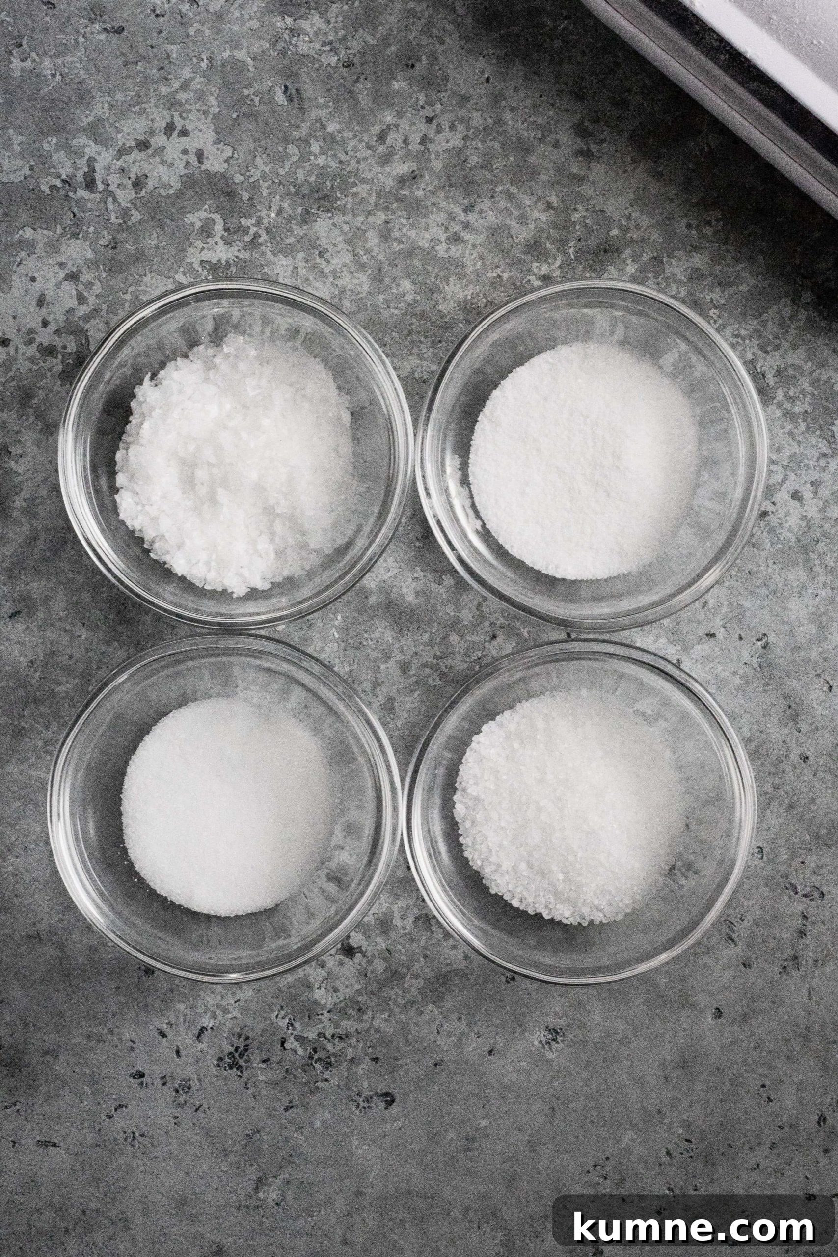  Fleur de sel (top left), fine sea salt (top right), table salt (bottom left), kosher sea salt (bottom right) 