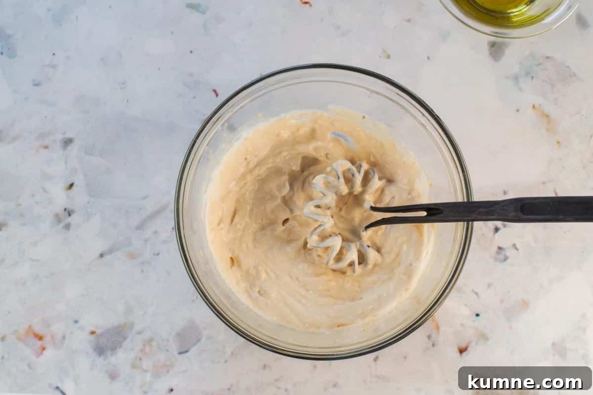 Sauce ingredients whisked together in a small bowl. 