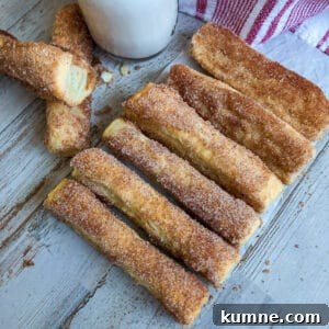 easy baked churros with a glass of milk for serving