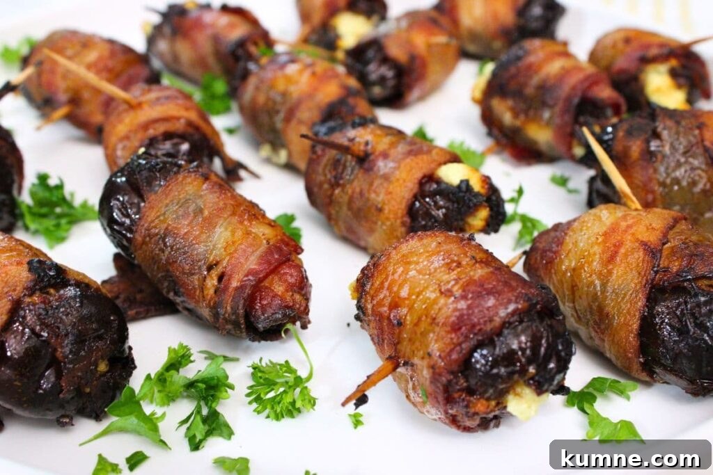 Crispy Air Fryer Bacon-Wrapped Dates Stuffed with Goat Cheese 13 closeup of several air fryer goat cheese stuffed bacon wrapped dates with toothpicks