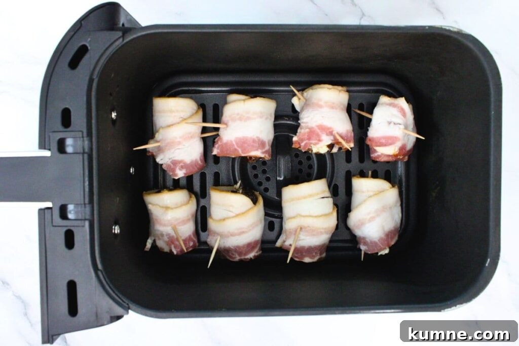 Crispy Air Fryer Bacon-Wrapped Dates Stuffed with Goat Cheese 7 add bacon wrapped dates to air fryer basket
