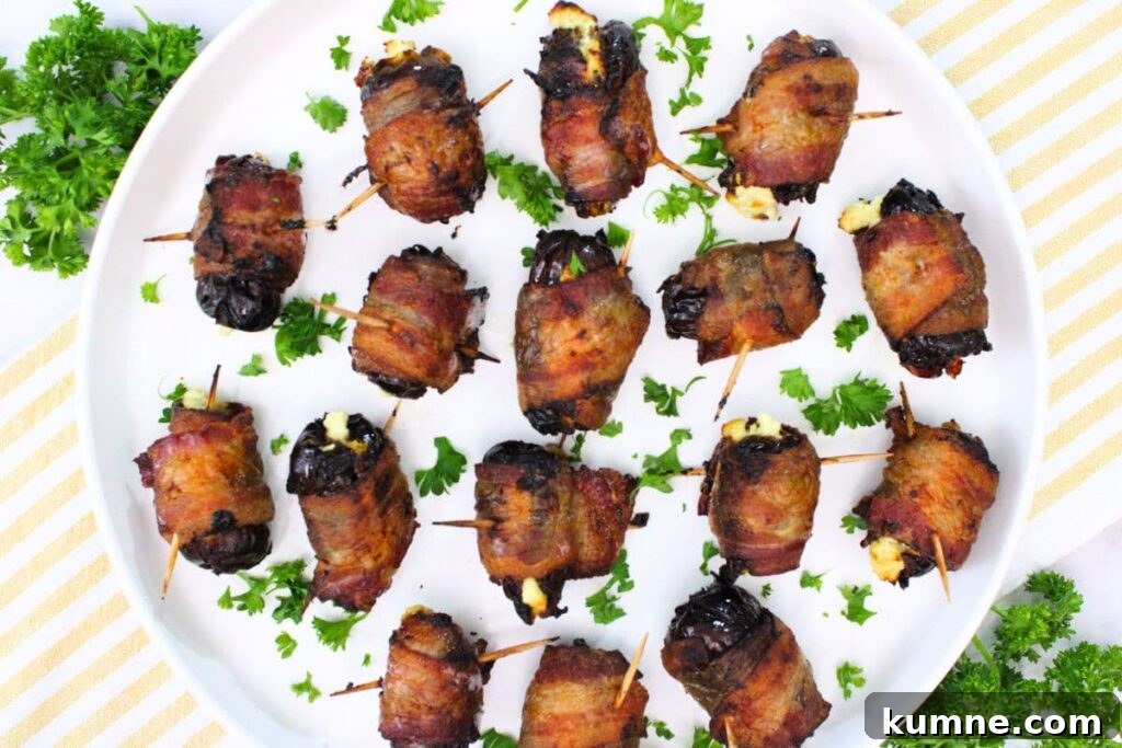 Crispy Air Fryer Bacon-Wrapped Dates Stuffed with Goat Cheese 8 overhead view of bacon wrapped dates on a plate