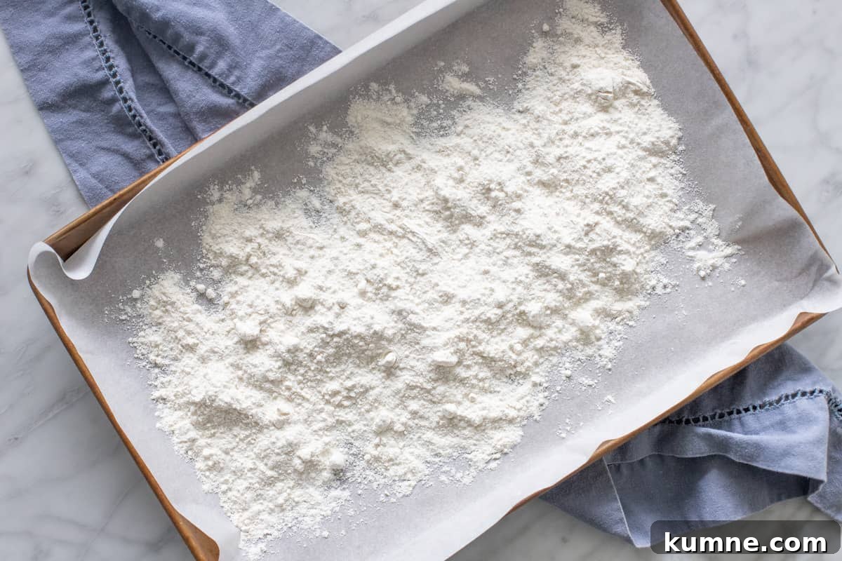 Flour on a lined cookie sheet