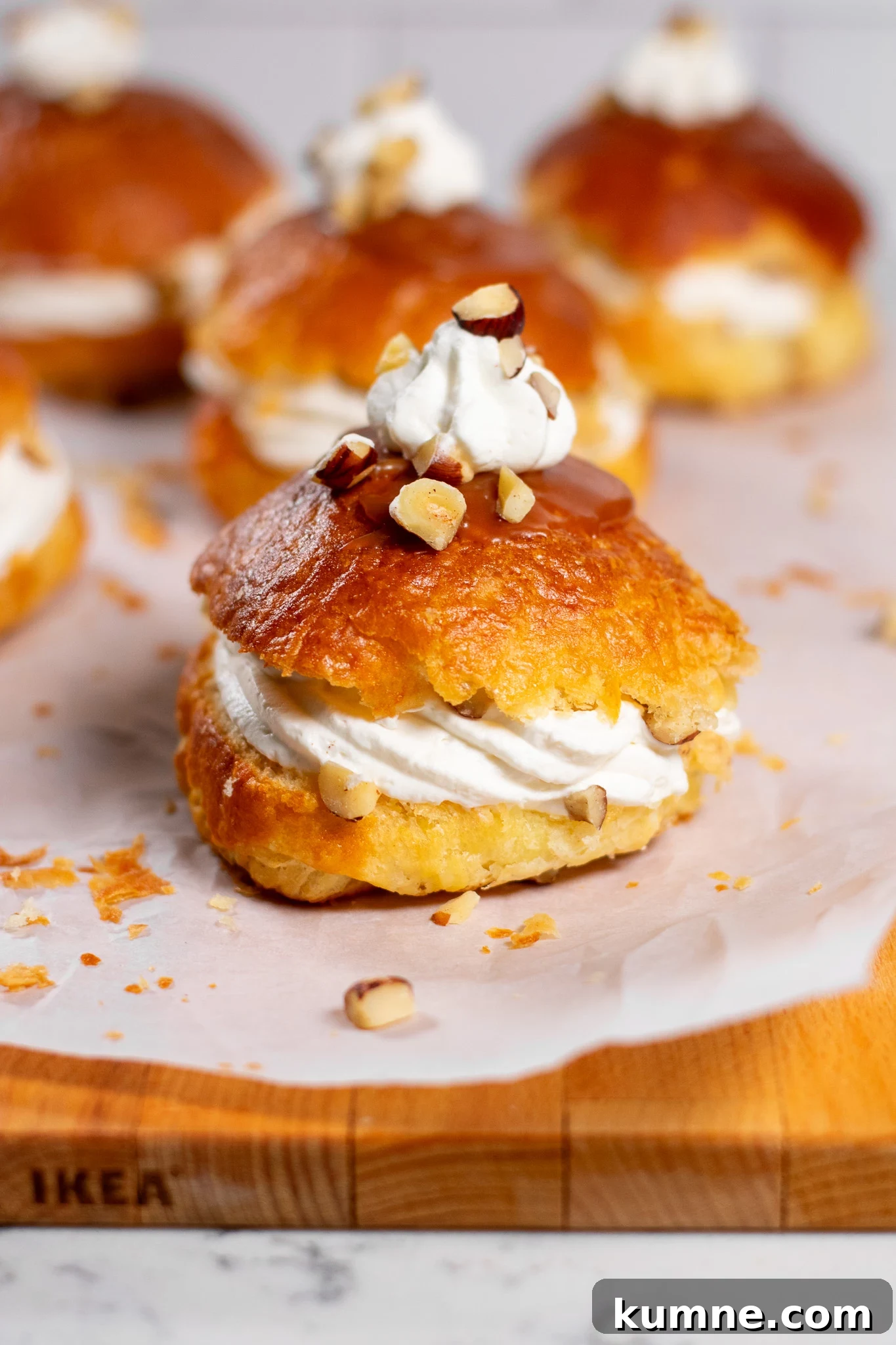 Salted Caramel Hazelnut Fastelavnsboller Recipe 2 Danish pastry buns filled with hazelnut, whipped cream, and salted caramel.