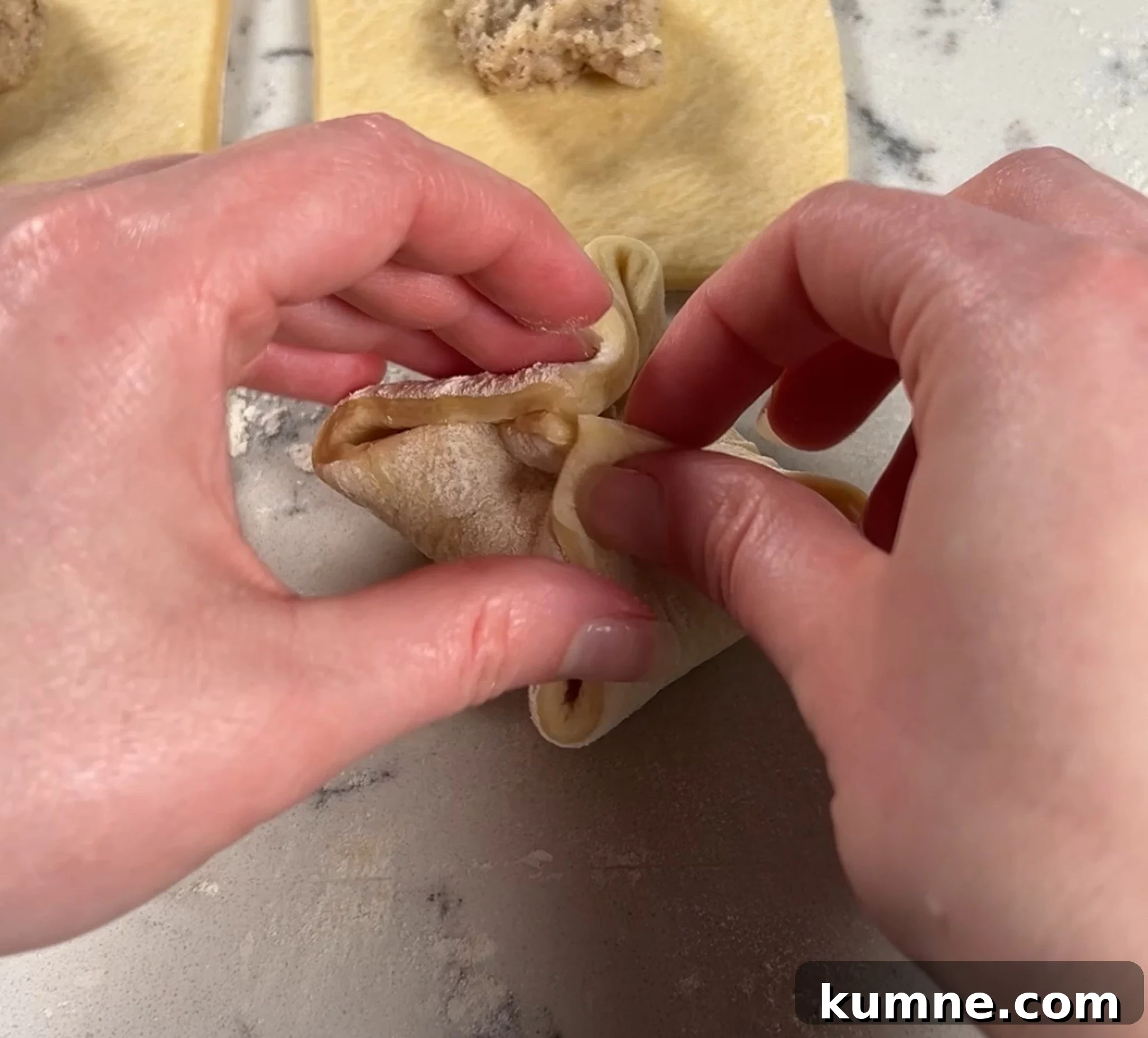 Salted Caramel Hazelnut Fastelavnsboller Recipe 14 Folding together the danish pastry dough.