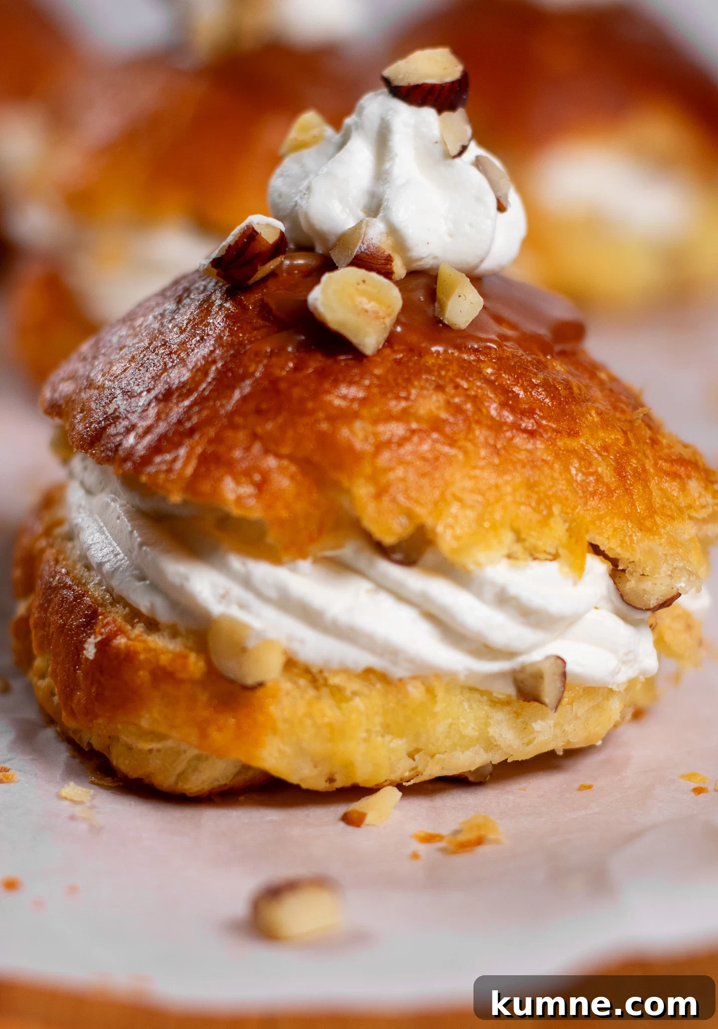 Salted Caramel Hazelnut Fastelavnsboller Recipe 4 Danish pastry buns filled with hazelnut, whipped cream, and salted caramel.