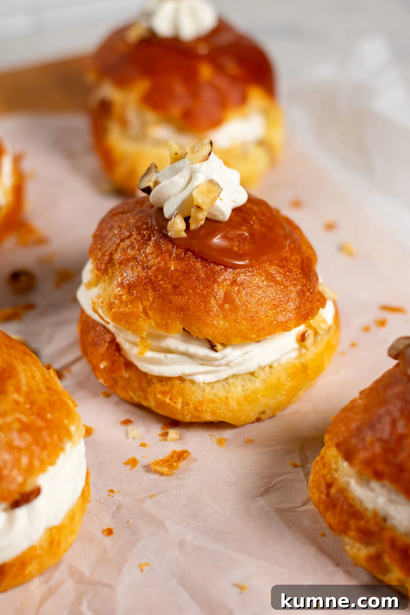 Salted Caramel Hazelnut Fastelavnsboller Recipe 5 Danish pastry buns filled with hazelnut, whipped cream, and salted caramel.