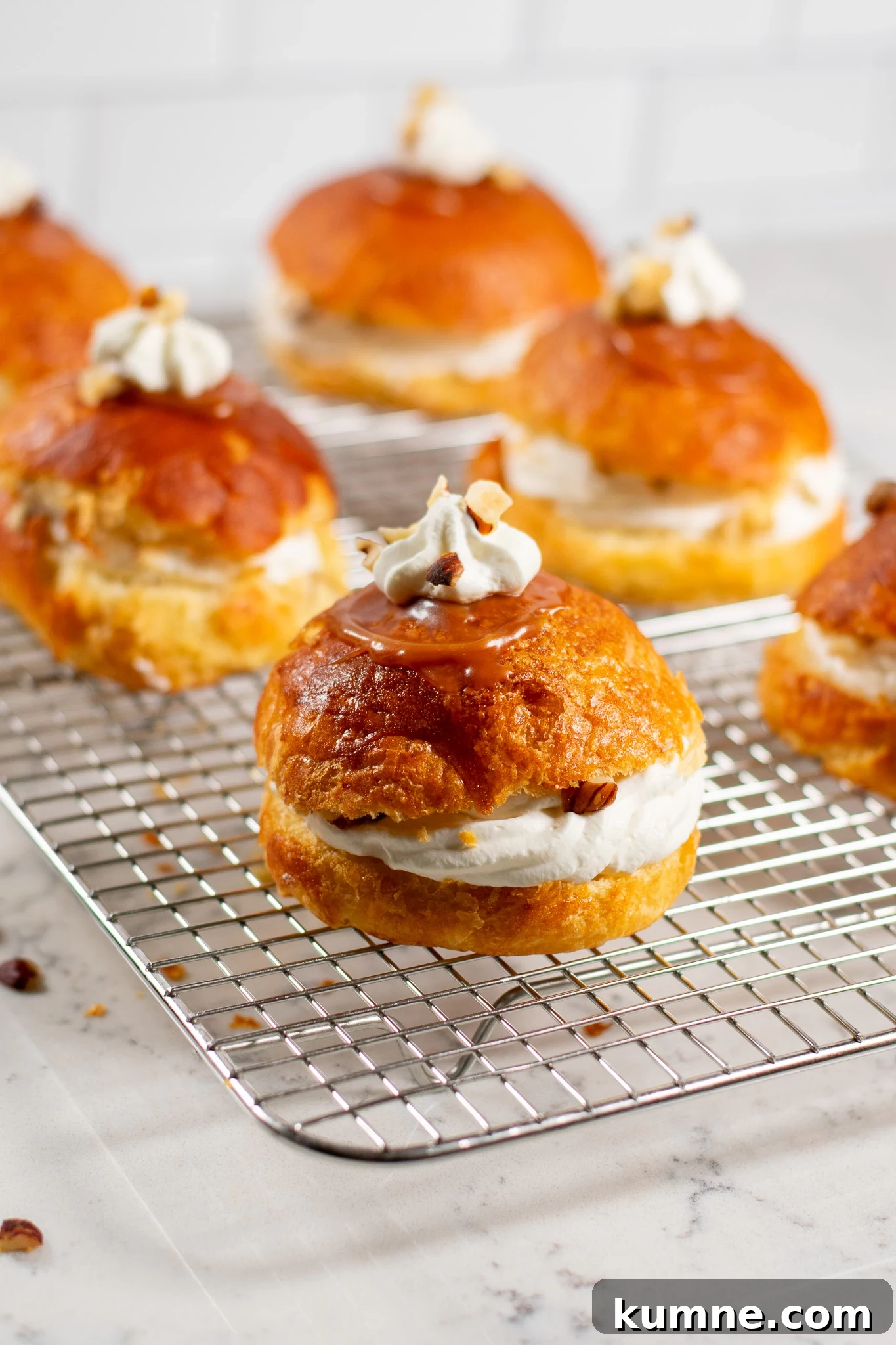 Salted Caramel Hazelnut Fastelavnsboller Recipe 6 Danish pastry buns filled with hazelnut, whipped cream, and salted caramel.