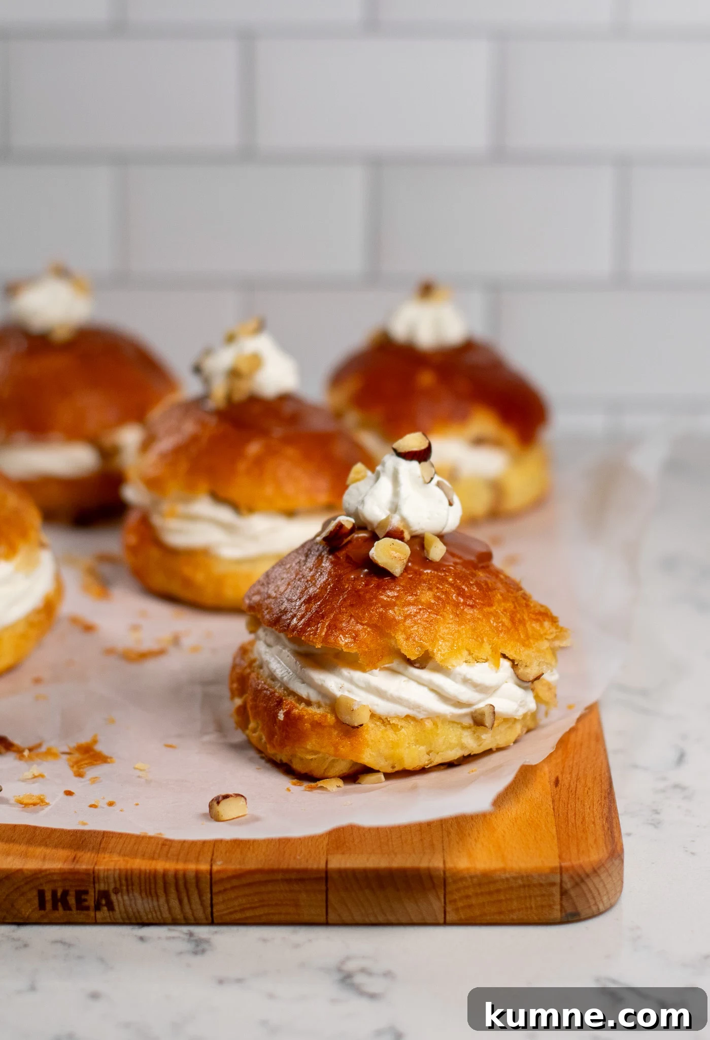 Salted Caramel Hazelnut Fastelavnsboller Recipe 7 Danish pastry buns filled with hazelnut, whipped cream, and salted caramel.