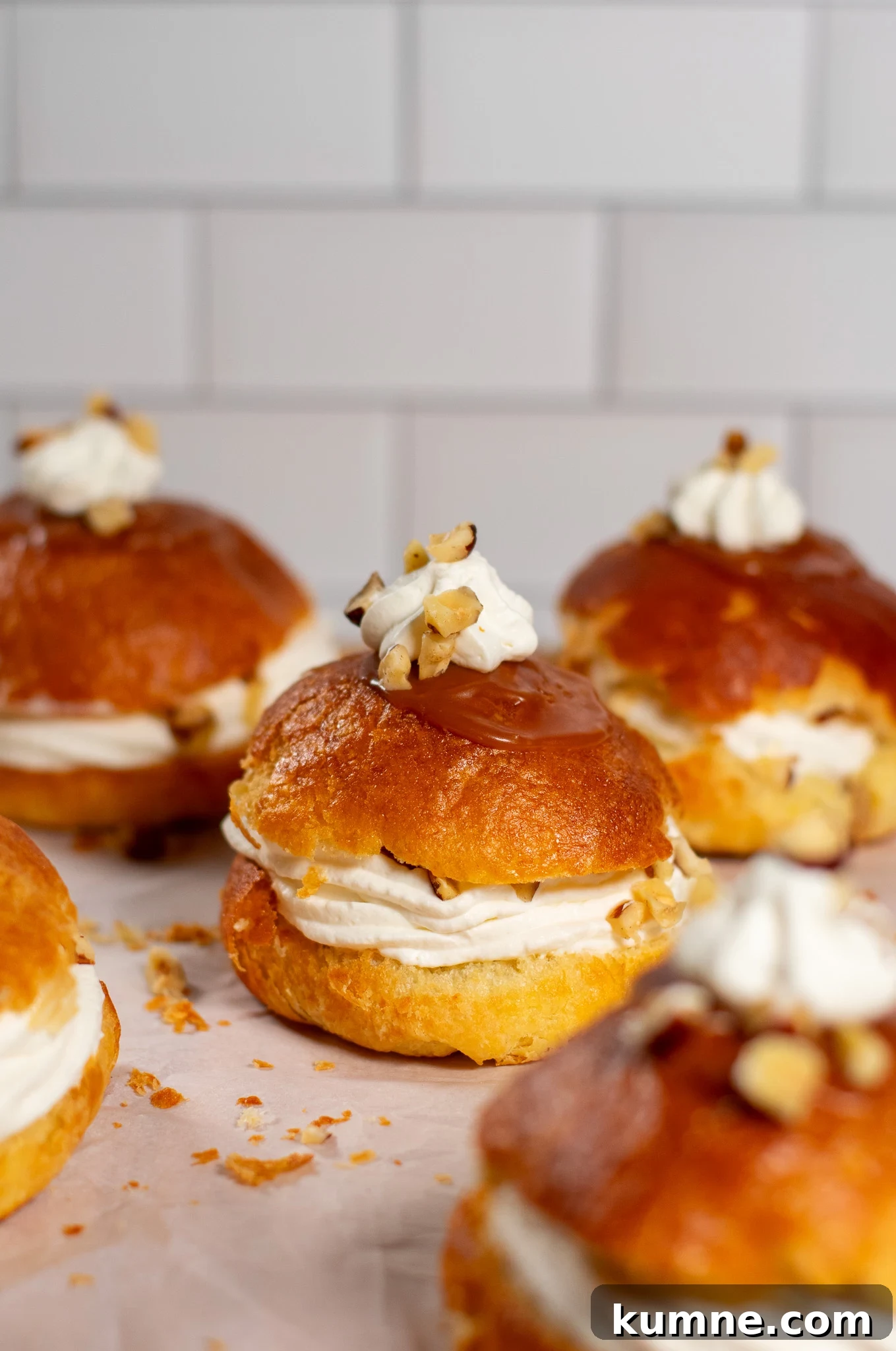 Salted Caramel Hazelnut Fastelavnsboller Recipe 9 Danish pastry buns filled with hazelnut, whipped cream, and salted caramel.