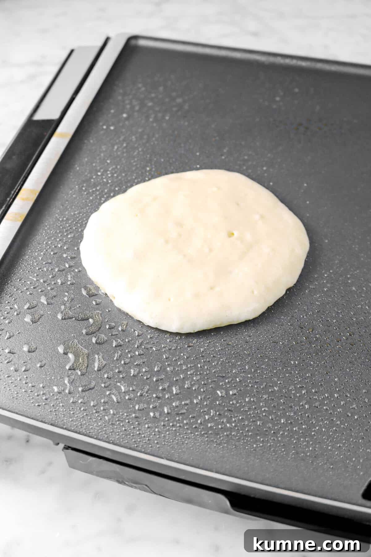 Fluffy Homemade Buttermilk Pancakes Recipe for Perfect Mornings 7 pancake batter on griddle