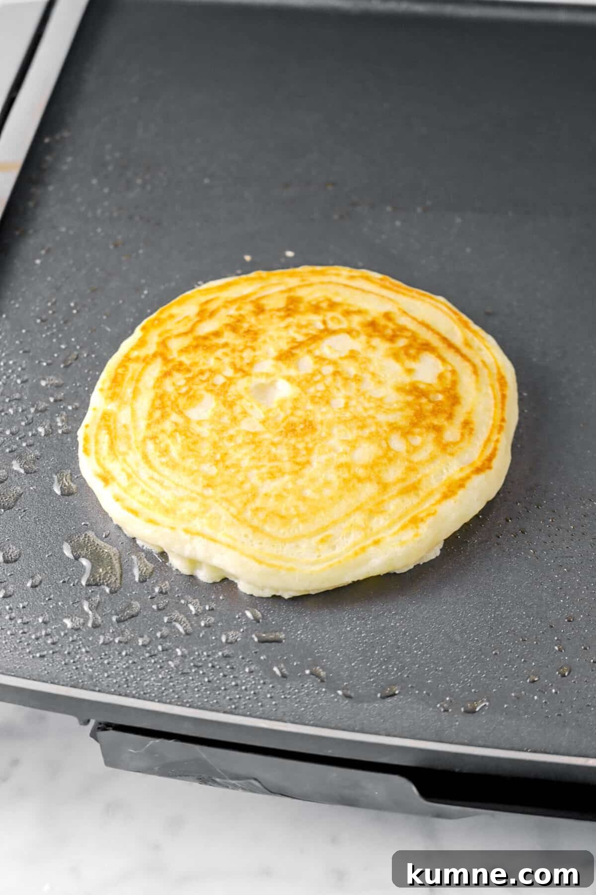 Fluffy Homemade Buttermilk Pancakes Recipe for Perfect Mornings 8 pancake on griddle