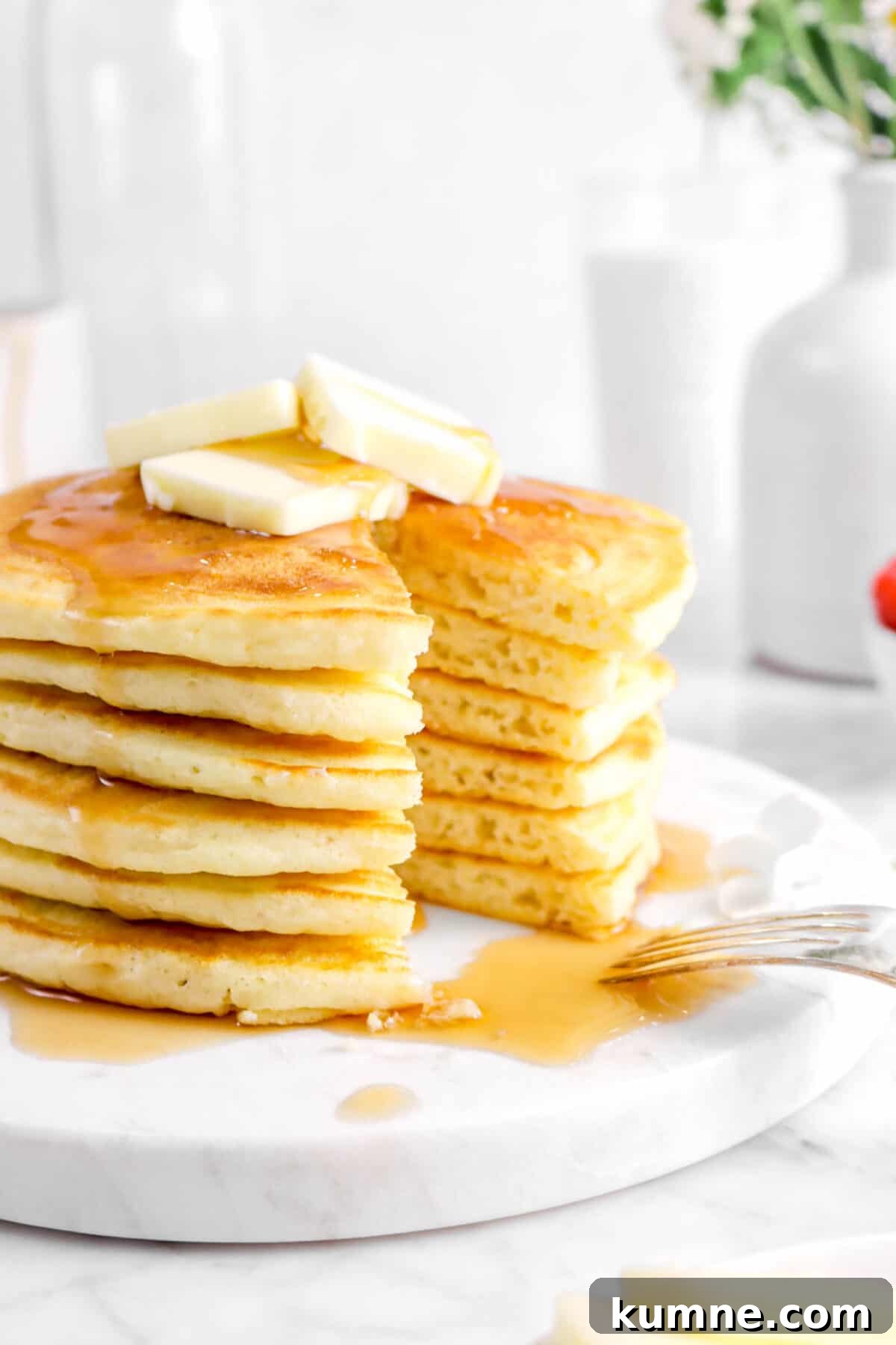 Fluffy Homemade Buttermilk Pancakes Recipe for Perfect Mornings 5 close up of buttermilk pancakes cut on marble surface