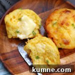 Cheddar Jalapeno Cornbread Muffins with butter on them