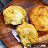 Cheddar Jalapeno Cornbread Muffins with butter on them