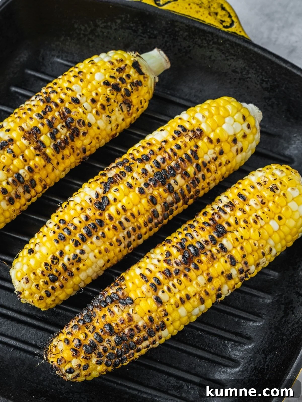 Elote Pasta Salad Inspired by Mexican Street Corn 5 Three corn cobs grilling in a grill pan.