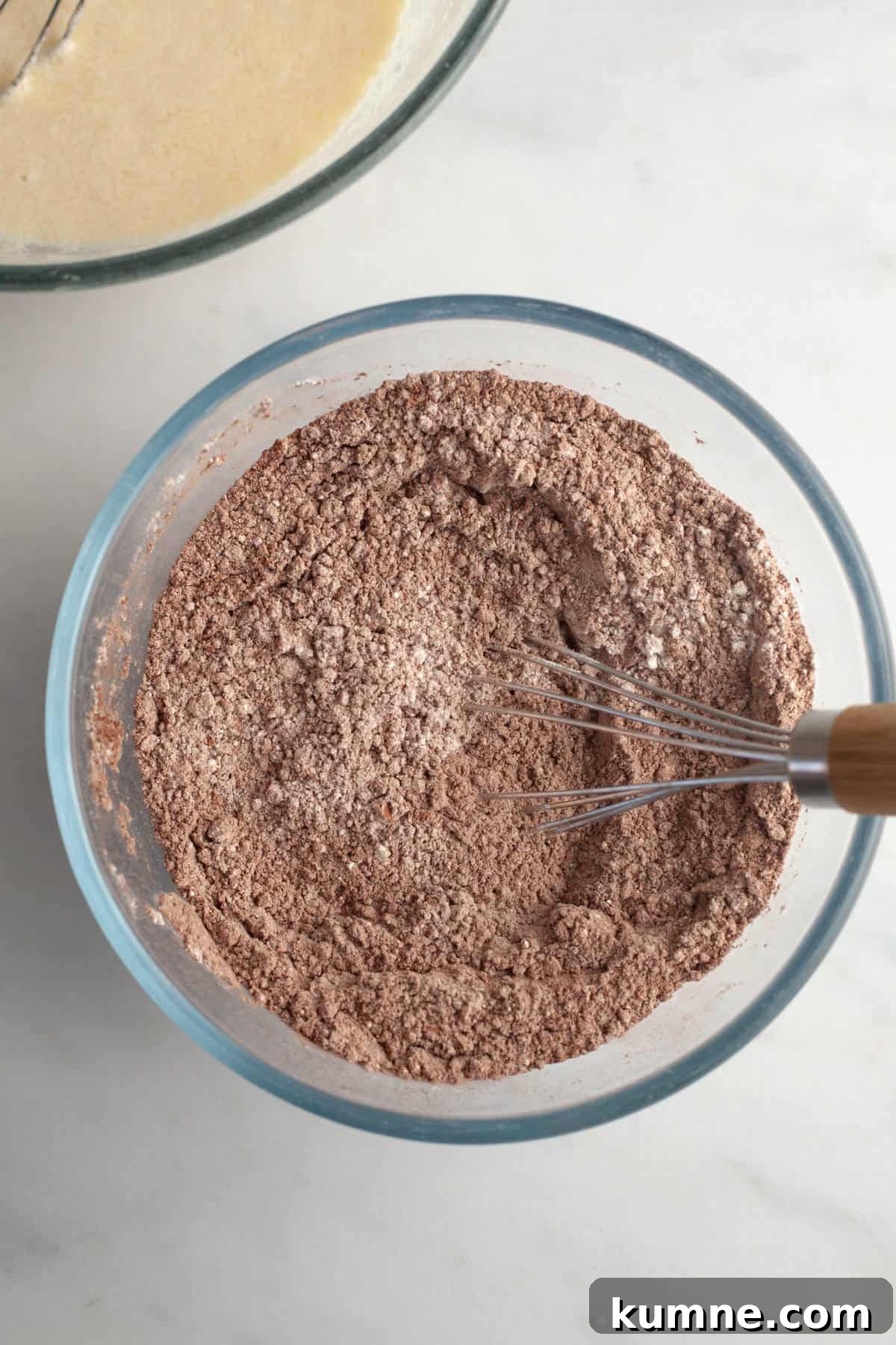 Moist Chocolate Cupcakes with Cream Cheese Frosting Recipe 4 Cocoa powder and flour in a bowl.