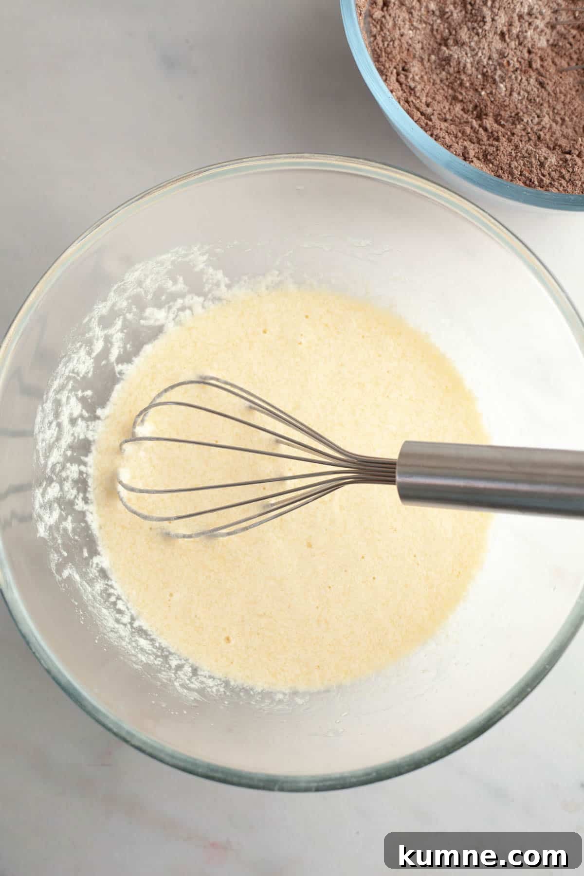 Moist Chocolate Cupcakes with Cream Cheese Frosting Recipe 5 Whisked pale yellow mixture in a bowl with a whisk.